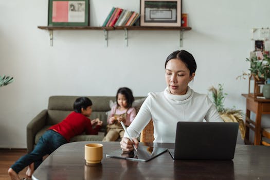 Mother using a tablet to connect with a parenting group